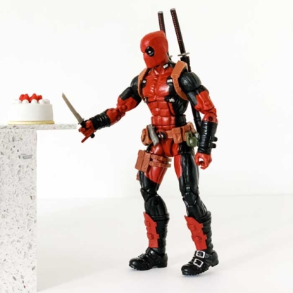 Deadpool Helping Himself to a Slice of Cake - Happy Clam Gifts Copyright